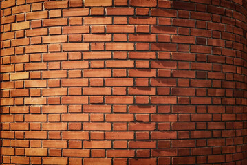 Red brickwork on a rounded wall, background.