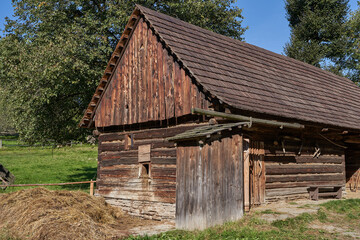 Fototapeta na wymiar Roznov pod Radhostem, Czech Republic - September 28, 2023 - the Wallachian village - wooden houses in rural countryside on a sunny autumn day