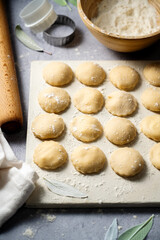 Cooking ravioli with ricotta and cottage cheese filling to dough.