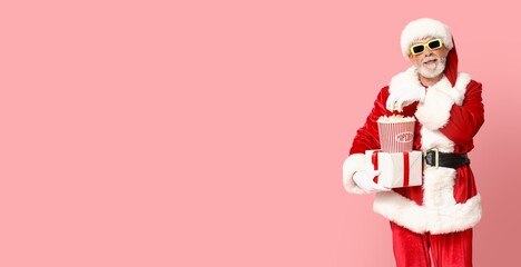 Santa Claus with popcorn and Christmas gift against pink background with space for text