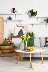 Interior of stylish living room with cozy sofa and coffee table