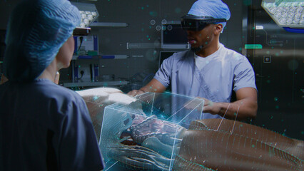 African American surgeon and nurse in AR headsets work in surgery room using holographic display....
