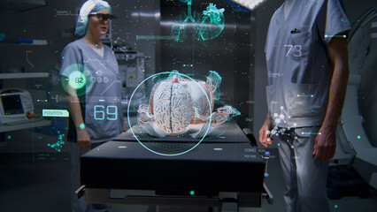 Male and female surgeons in AR headsets work in operating room using futuristic holographic display. 3D graphics of virtual human skeleton and organs. AI technology. Innovative medical solutions.