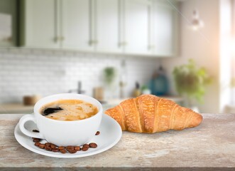 fresh tasty croissants on dining table