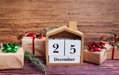 Wooden calendar with the date 25 December .Christmas background 