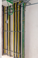 installation of pipes for the heat pump, pipes mounted on the wall