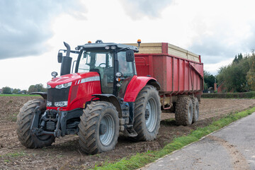 Obraz premium red tractor on a field