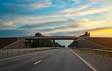 Automobile interchange with bridges at sunset.