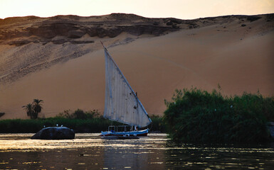 Sailing around the beautiful islands of Aswan with a pitoresque sailingboat at sunset