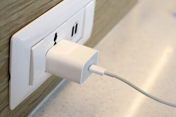 Electrical power socket, Phone plugged in on socket wall