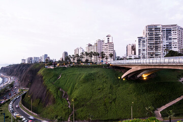 PERU Panoramic view of the Villena Rey Bridge of the Miraflores district with luxurious apartments and Pacific Ocean at night © Luis