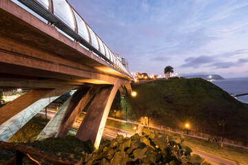 PERU Panoramic view of the Villena Rey Bridge of the Miraflores district with luxurious apartments and Pacific Ocean at night © Luis