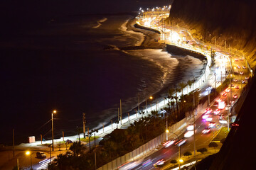 Miraflores Peru highway at night on the coast of the Pacific Ocean-Costa Verde, with a traffic aerial view © Luis