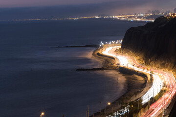 Miraflores Peru highway at night on the coast of the Pacific Ocean-Costa Verde, with a traffic aerial view © Luis