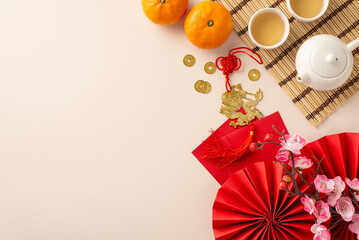 Transport yourself into heart of Chinese New Year: top view fans, Feng Shui artifacts, teapot set, green tea— harmonious family tradition. Tangerines, sakura, pastel backdrop create canvas for your ad