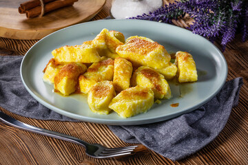 Homemade lazy noodles with cheese, crumbs and melted butter.