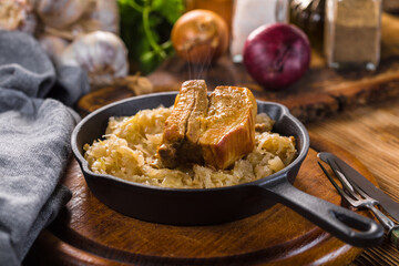 Traditional spare ribs baked in sauerkraut.