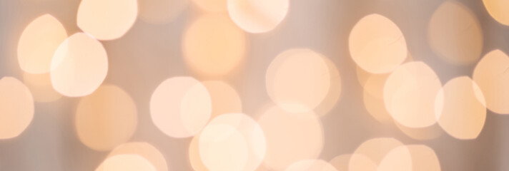 Abstract festive Christmas golden lights bokeh. Defocused, sparkling elements. Template for holiday...