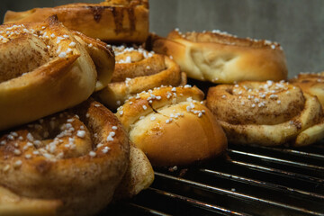 Side view of a pile of delicious Swedish cinnamon buns. Homemade Swedish fika. 