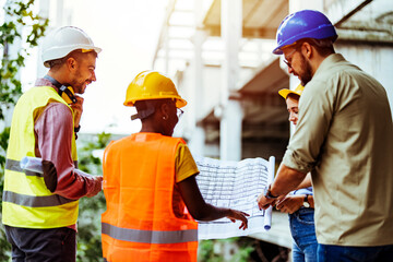 Diverse Team of Specialists Taking a Walk Through Construction Site. Real Estate Building Project...