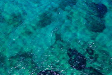 Sea surface with waves and ripples. Aerial top to down view, static shot