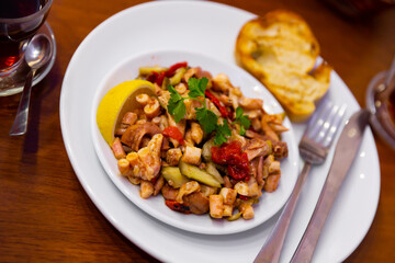 Turkish seafood octopus salad Ahtapot salatasi in a white ceramic plate