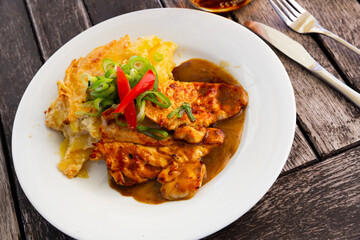 Fried chicken with baked potatoes and vegetables. High quality photo