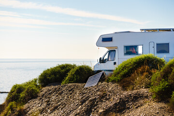 Caravan camp on seahore with portable solar panel