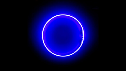 Real neon circle. Blue neon ring on black background. Neon background.
