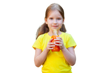 Young school age child girl holding a glass bottle full of juice in hands in front of her, one...