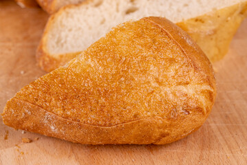 wheat loaf of bread close-up on the table