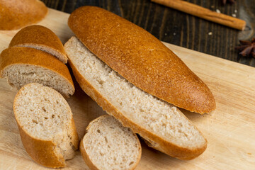 fresh wheat bread with bran on the cutting board