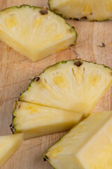 sliced ripe yellow pineapple, a large number of pieces