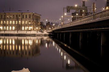 View of bridge over river at night