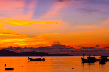 Beautiful colorful sunset or sunrise sky over sea with dramatic clouds nature environment background