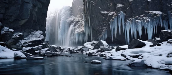  Glacier's melting icicles trickle into stream. © 2rogan