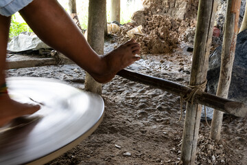 Obraz premium Artisan is working, manually, on the ceramic work in Maragogipinho in the city of Aratuipe, Bahia.