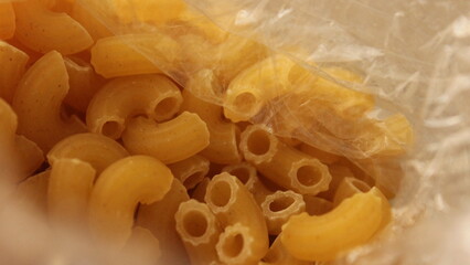 Clear plastic packaging reveals the potential of uncooked macaroni