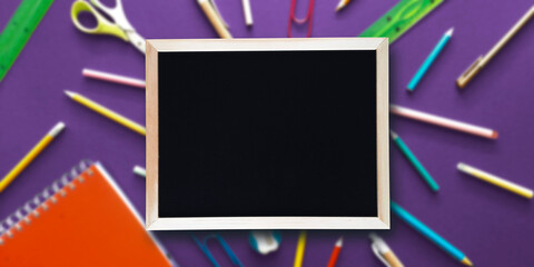 Banner Blank black school board with place for text. Chalkboard for Kids and students on purple background of preschool supplies. Header with copyspace for website, advert, blog. Flat design