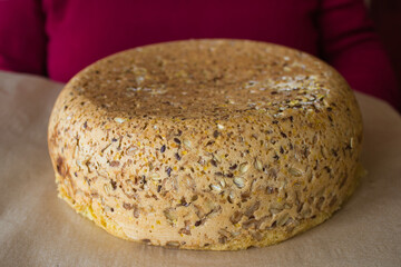 freshly baked loaf of bread with sunflower seeds