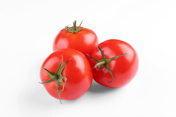 Fresh ripe red tomatoes on white background