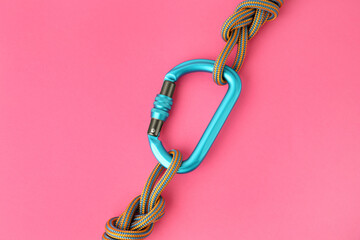 One metal carabiner with ropes on bright pink background, top view