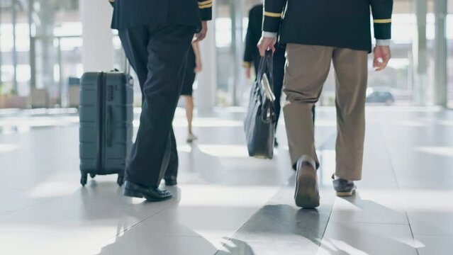 Luggage, airport lobby and pilot walking with bag for flight, schedule or international transportation job. Men, suitcase and team together for global travel, airplane and ready to start working