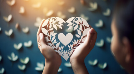 Visualize a powerful symbol of compassion and support as hands hold a heart-shaped paper family cutout - obrazy, fototapety, plakaty