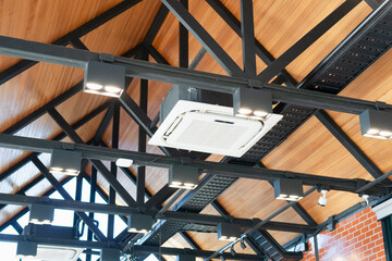 Modern ceiling mounted cassette type air conditioning system in coffee shop
