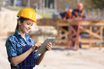 Fototapeta premium Portrait of young cvil engineer at work on construction site