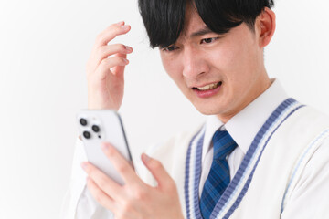 学生服を着ている若い男性　学生イメージ