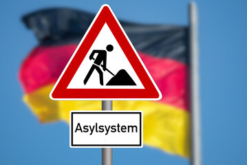 Flagge von Deutschland und Baustelle Asylsystem