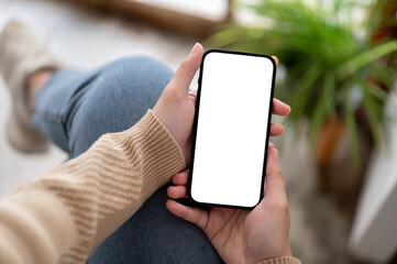 A white-screen smartphone mockup in a woman's hand. social media, mobile application, chatting