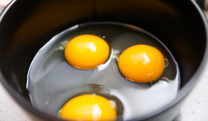 brown eggs in a rustic basket on wooden table, natural light, farm-fresh concept
